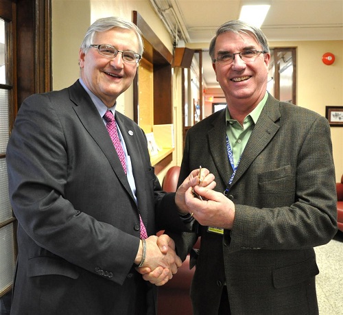 George Weber, President & CEO of The Royal, handing the keys for Elmgrove over to Ray Marshall